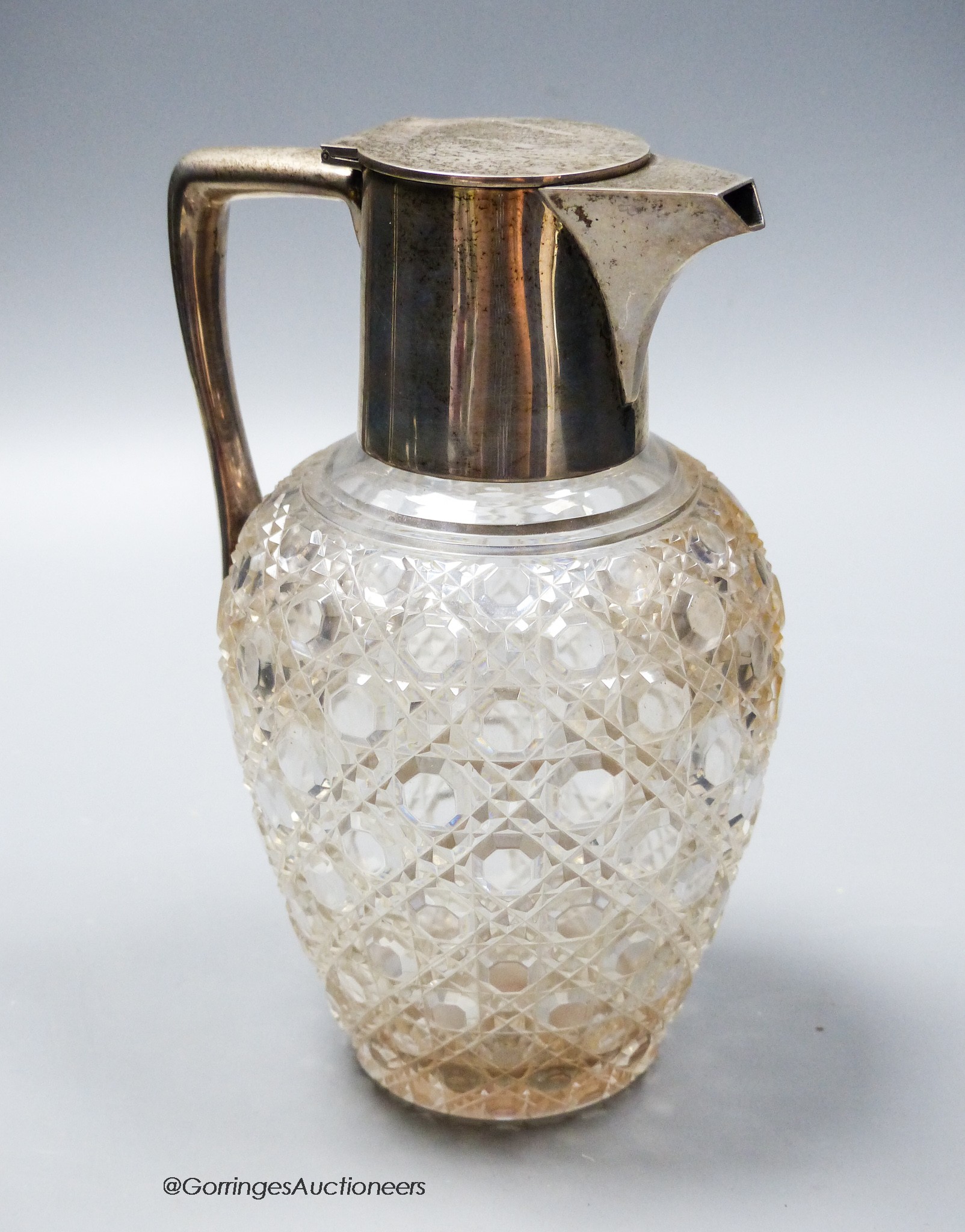 A George V silver mounted cut glass claret jug, Goldsmiths & Silversmiths Co Ltd, London, 1914, height 19.1cm.